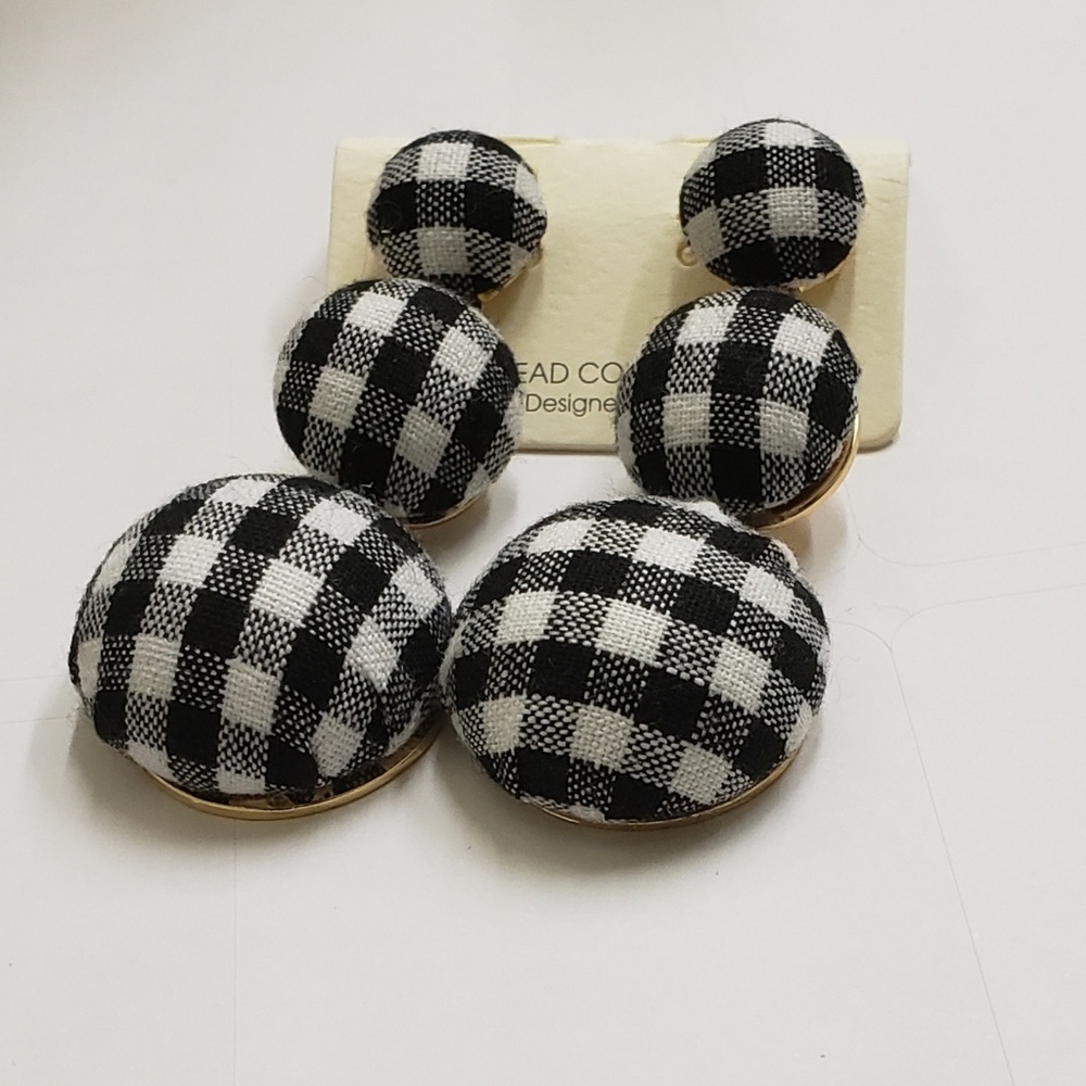 Earrings by: New light ink apparel and accessories